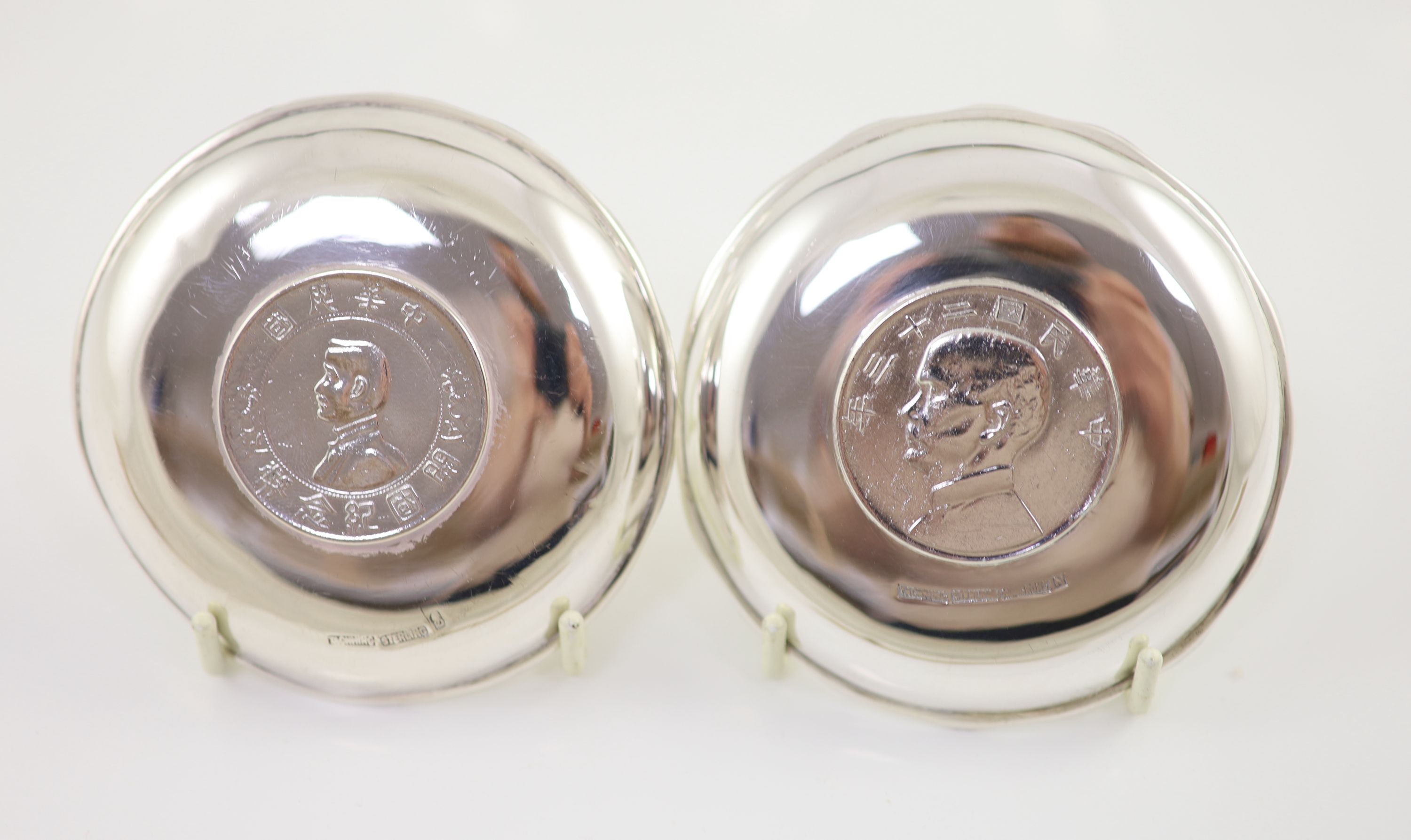 Ten early 20th century Chinese Export small Sterling silver coin inset dishes with shaped 'bamboo' edges, by Tach Hing, Hong Kong,
